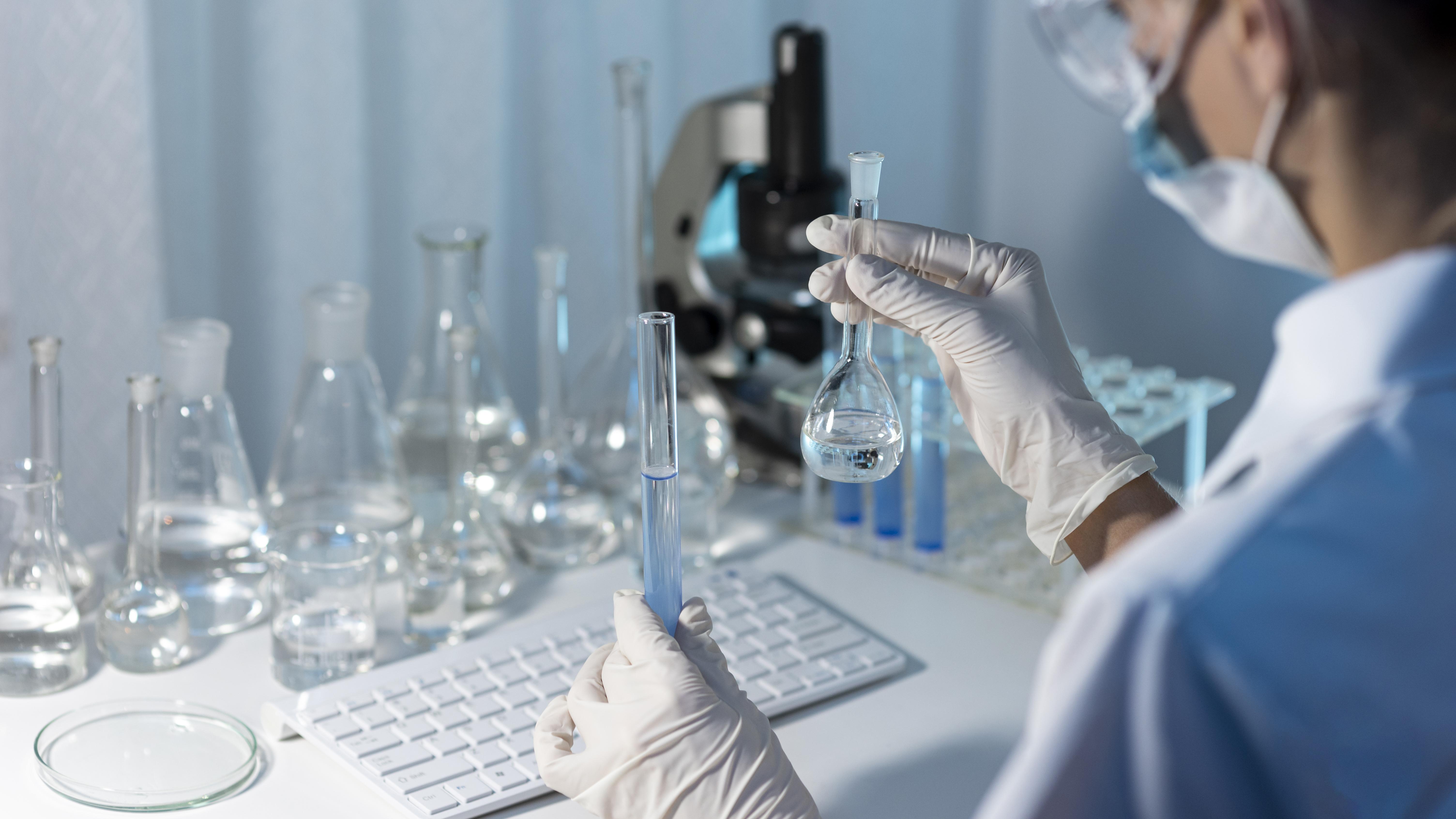 close-up-researcher-holding-glassware.jpg